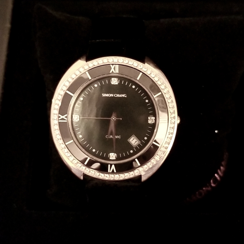 Simon Chang women watch.  Pink gold with black mother of pearl interior.